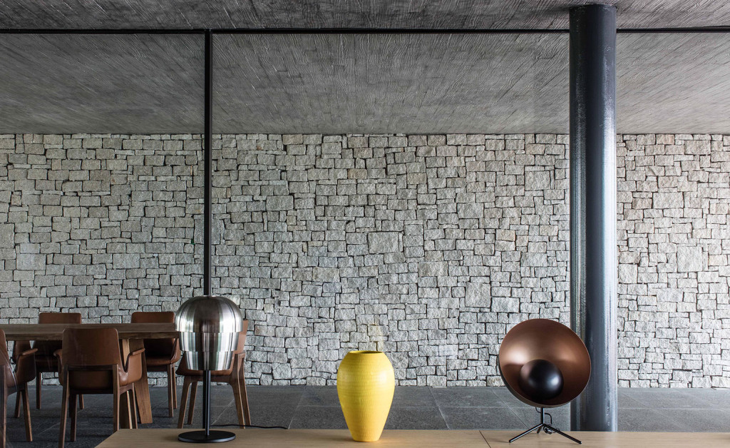Expansive living and dining areas have been crafted using natural materials